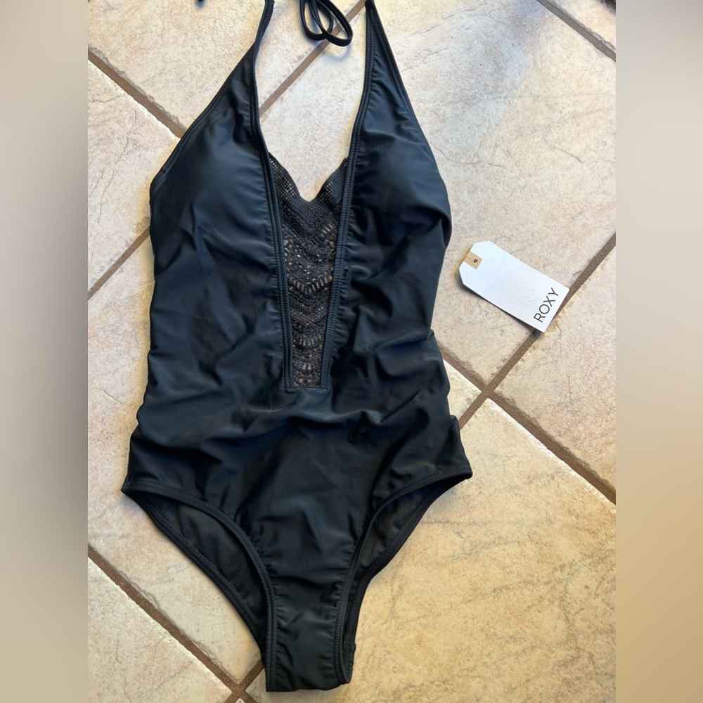 Brand NEW! Tags and feminine liner attached! One piece ROXY bathing suit.